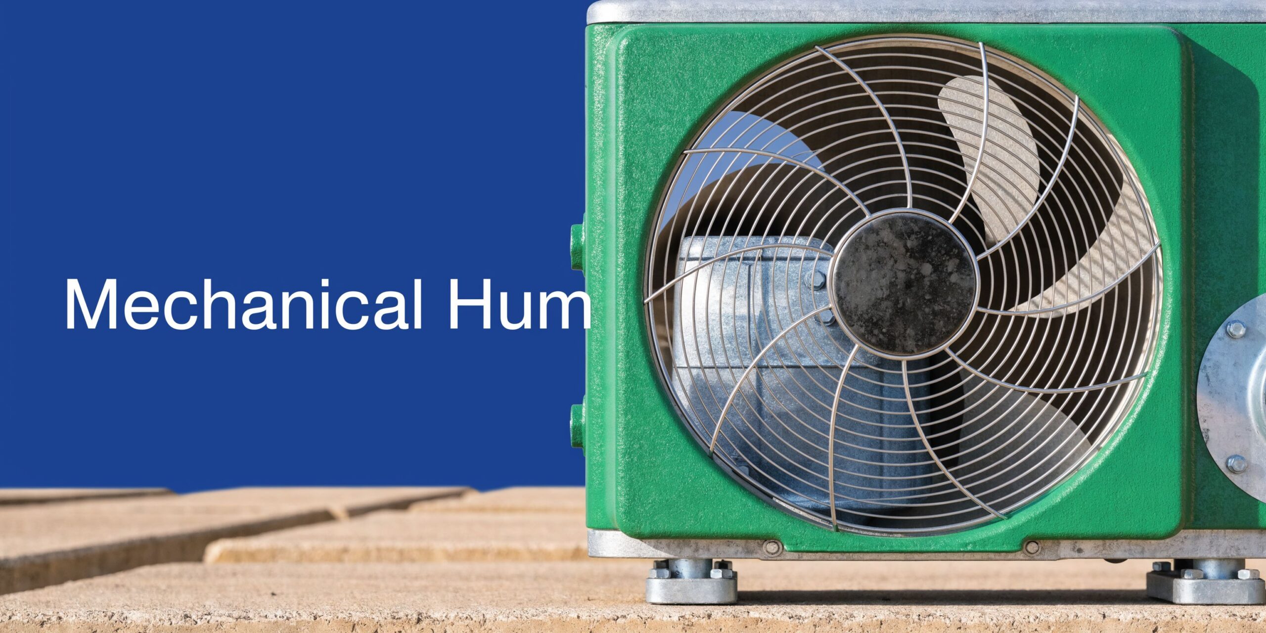Air Conditioner Humming: Causes & Fixes 4 A close-up view of an outdoor air conditioning unit featuring a green housing and metal fan grill.
