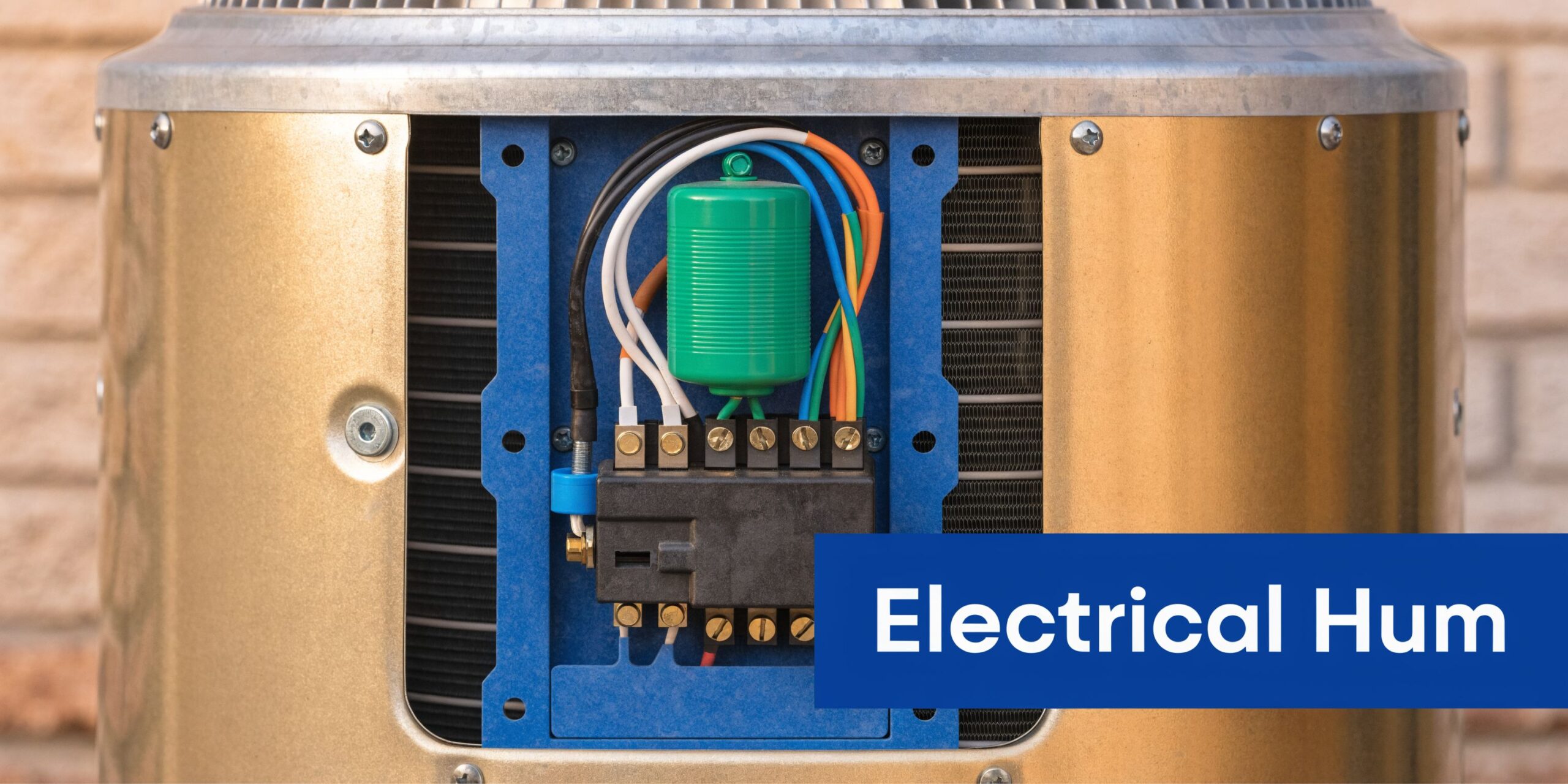 Air Conditioner Humming: Causes & Fixes 3 Close-up of the electrical wiring and capacitor inside an outdoor residential air conditioner unit component box.